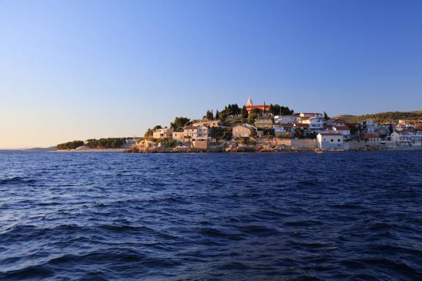 Croatia Primosten town. Coastal town of Primosten in sunset light.