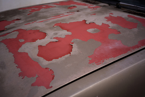 Sun-damaged paintwork on a car bonnet. stock video