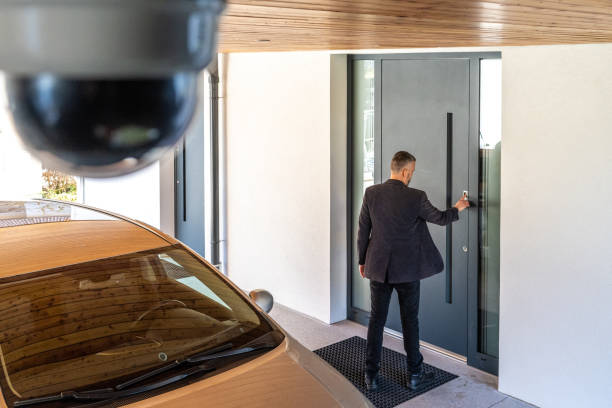 istock Man's finger pressing on fingerprint scanner to enter his house 1415760837