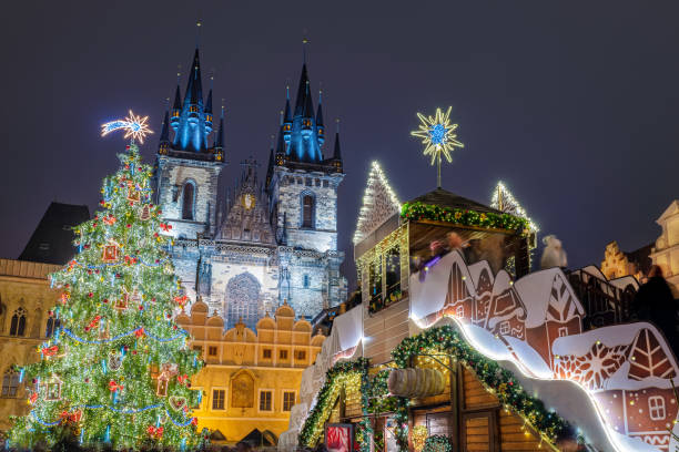 Beautiful Christmas scene outdoors in Prague Christmas scene outdoors with tree and fairy tale decorations, in front of Our Lady Tyn Church in Prague, Czech Republic. prague stock pictures, royalty-free photos & images