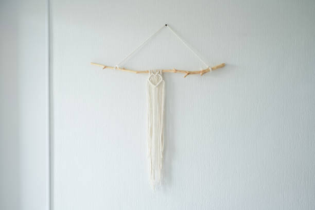 istock Handmade macrame panel hanging on the wall in the form of a heart 1415760916