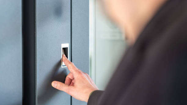 istock Man's finger pressing on fingerprint scanner to enter his house 1415761087