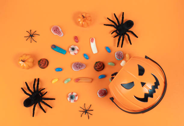 istock Halloween Jack o Lantern basket with candies 1415762196
