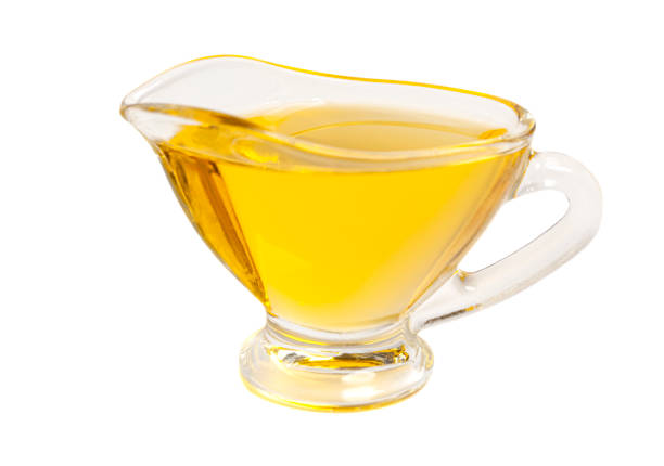 Bowl with olive oil isolated on white.