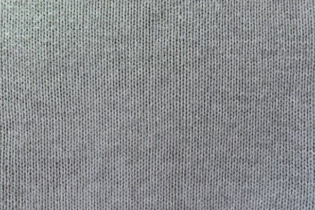 istock Knitted gray pattern closeup, detailed yarn background. 1415764187