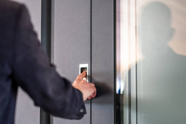istock Man's finger pressing on fingerprint scanner to enter his house 1415764299