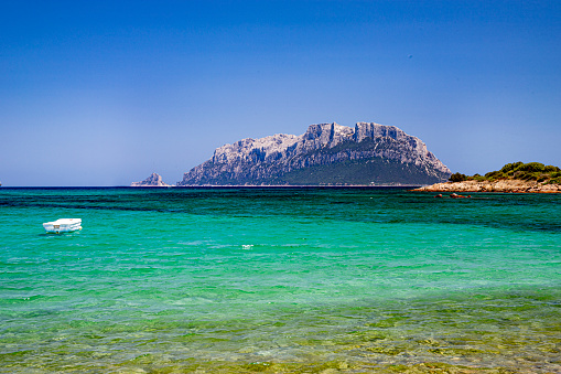 Aerial of the famous Pedra Longa, a rock spike 128m in height which stands exactly on the coastline Baunei, set on the slopes of Mount Santo, includes 30 kilometers of matchless coastal beauty. Converted from RAW.