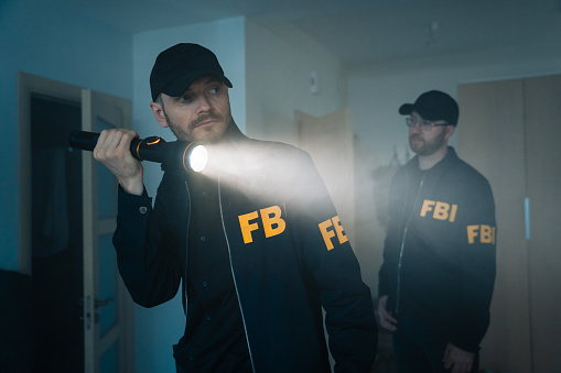 FBI agents at work. Action movie filming