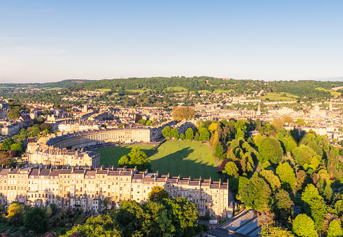 An aerial view over the historic city of Bath in Somerset, England. The city's centre features striking Georgian architecture.