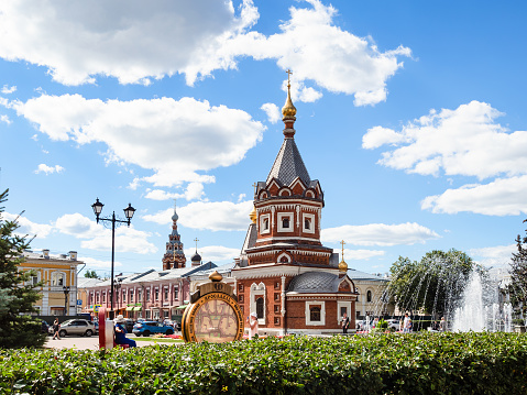 Yaroslavl, Russia - August 11, 2022: Chapel of Saints Alexander Nevsky and water fountain on Andropova street in Yaroslavl city on sunny summer day