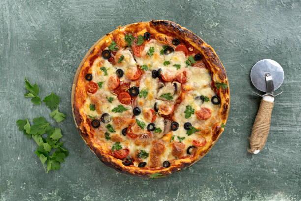 istock Delicious homemade pizza with cheese and tomatoes 1415768795