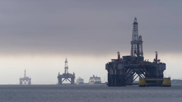Oil Rigs Moored in the Cromarty Firth, Scotland Oil rigs moored in the shallow waters of the Cromarty Firth in Scotland. oil rigs moored in the cromarty firth scotland stock pictures, royalty-free photos & images
