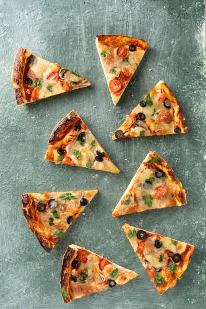 istock Italian pizza margherita cut into pieces 1415771198