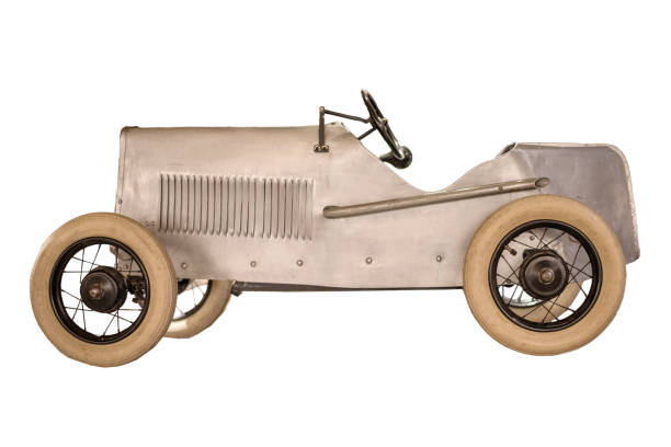 Retro children's racing car isolated on white background