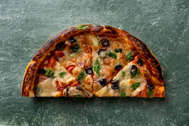 istock half a delicious homemade italian pizza on the table 1415771682