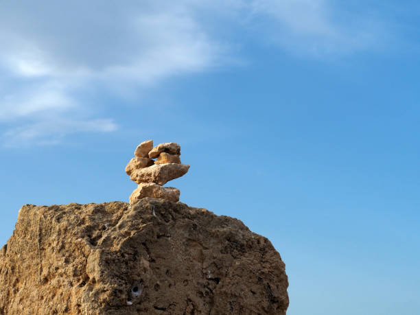 istock Pyramid of stones against the blue sky. 1415772081