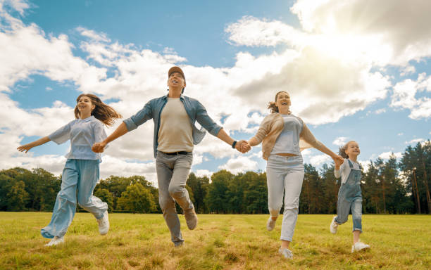 istock Happy family in the park 1415773233