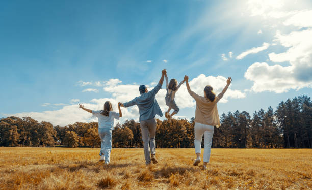 istock Happy family in the park 1415773266