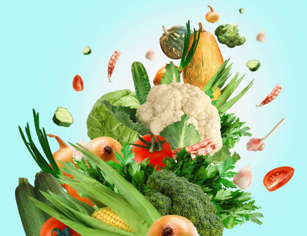 istock Set of fresh vegetables on a light blue background. Levitating vegetables 1415773763