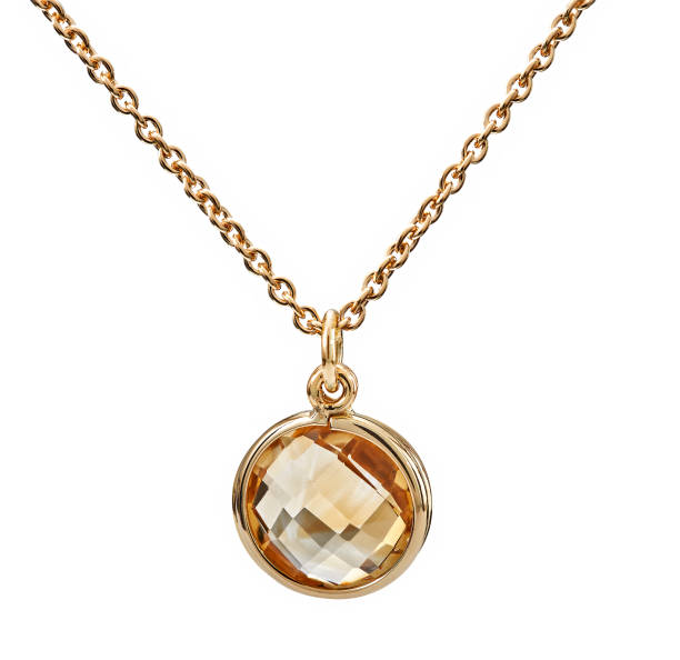 istock Golden necklace with citrine gemstone isolated on white 1415774670