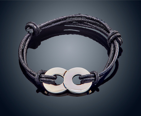 leather bracelet isolated on grey background.