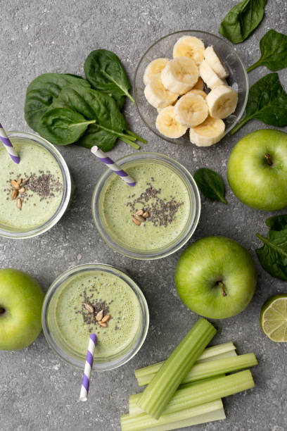istock Healthy green spinach smoothie in glass jars 1415775713