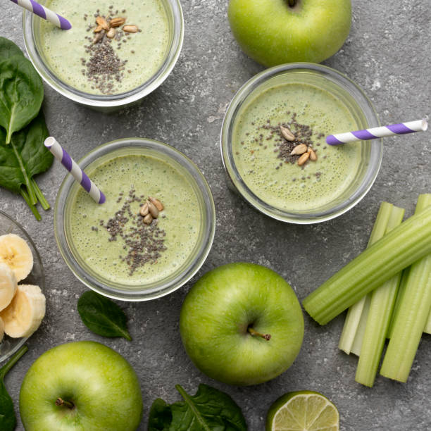 istock Healthy green spinach smoothie in glass jars 1415775714