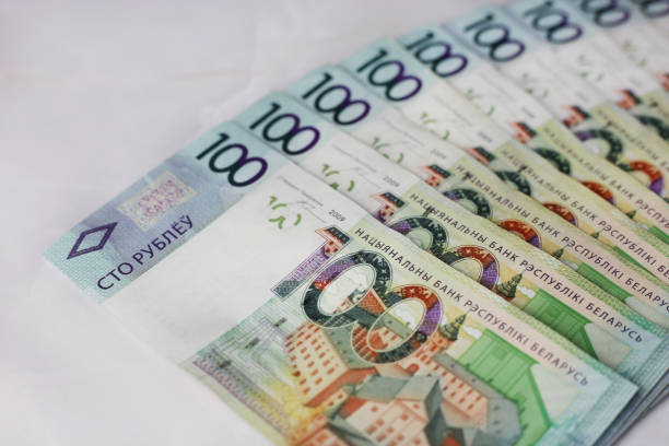 istock Lined banknotes of 100 Belarusian rubles on a gray background 1415776060