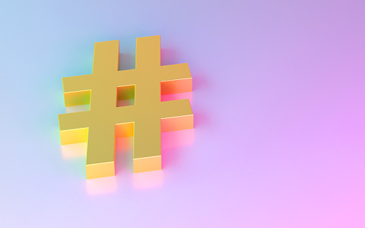 Gold colored Hashtag Symbol on colorful background