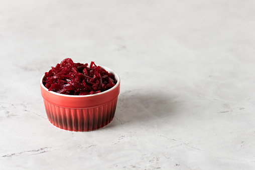 Tasty Homemade Fermented Beetroot on Small Red Bowl Gray Background Copy Space