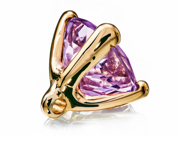 istock purple amethyst gem stone in golden setting isolated 1415777965