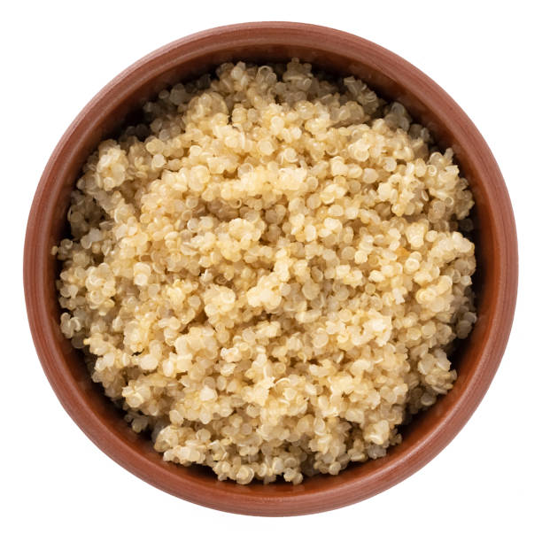 istock Boiled quinoa in bowl isolated on white 1415778886