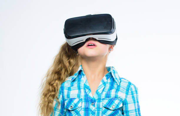 istock Girl cute child with head mounted display on white background. Virtual education for school pupil. Get virtual experience. Virtual reality concept. Small kid use modern technology virtual reality 1415782542