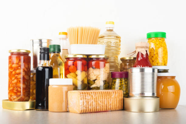 emergency survival food set on white kitchen table - undernourishment imagens e fotografias de stock