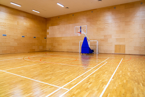 Modern empty gym for basketball, volleyball or indoor soccer.