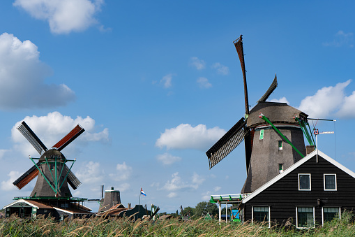 Zaanse Schans, Zaandam, Netherlands - September 16 2021: Historic windmills in Zaandam. It is an area known for its historic and well-preserved windmills and houses.