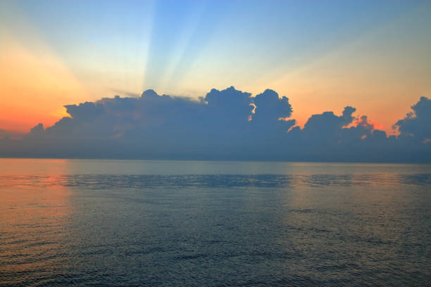 The photo was taken in the city of Odessa in Ukraine. The picture shows the sunrise on the sea after a storm.