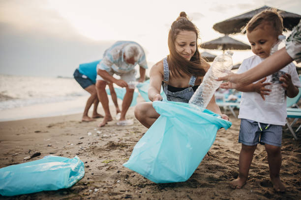 istock Group of people cleaning beach 1415791079