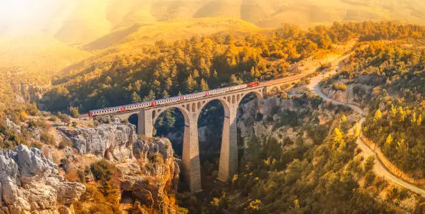 Photo of Vintage brick bridge between hills. Old railway bridge. It called Varda. Adana province in Turkey.