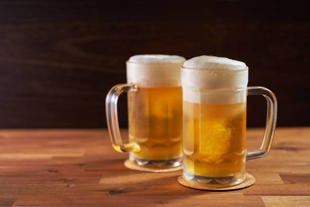 istock refreshing cold beer glasses on wooden background 1415791910
