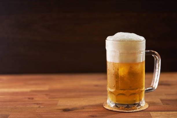 istock refreshing cold beer glasses on wooden background 1415791969