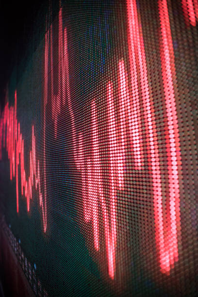 istock stock chart trend red line in big LED screen 1415793226