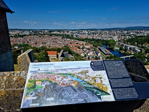 The Citadel of Besançon (French: Citadelle de Besançon) is a 17th-century fortress in Franche-Comté.  The image shows a wall of the Citadel captured during summer season with a city map.