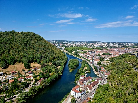 The image shows shiws the Dubs river with the city Besancon. Captured during summer season.