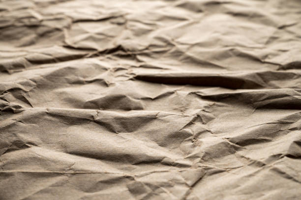textura del papel kraft marrón arrugado de la bolsa de papel - paper craft brown wrinkled fotografías e imágenes de stock