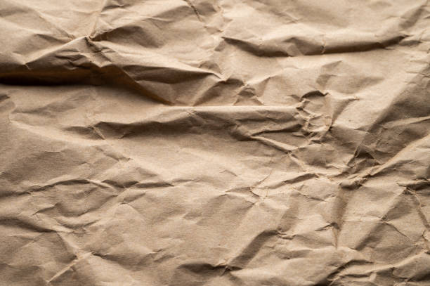 textura del papel kraft marrón arrugado de la bolsa de papel - paper craft brown wrinkled fotografías e imágenes de stock