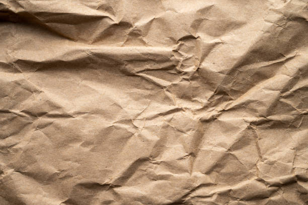 textura del papel kraft marrón arrugado de la bolsa de papel - paper craft brown wrinkled fotografías e imágenes de stock