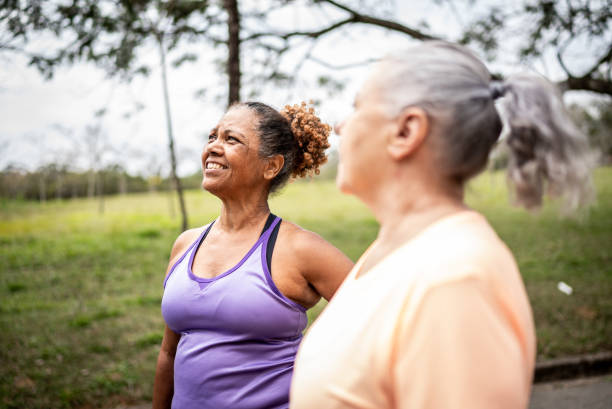 istock Senior women walking in a park 1415794329