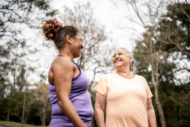 istock Senior women walking in a park 1415794336