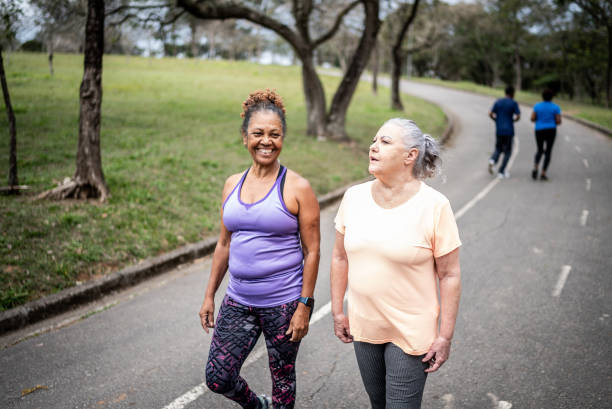 istock Senior women walking in a park 1415794339